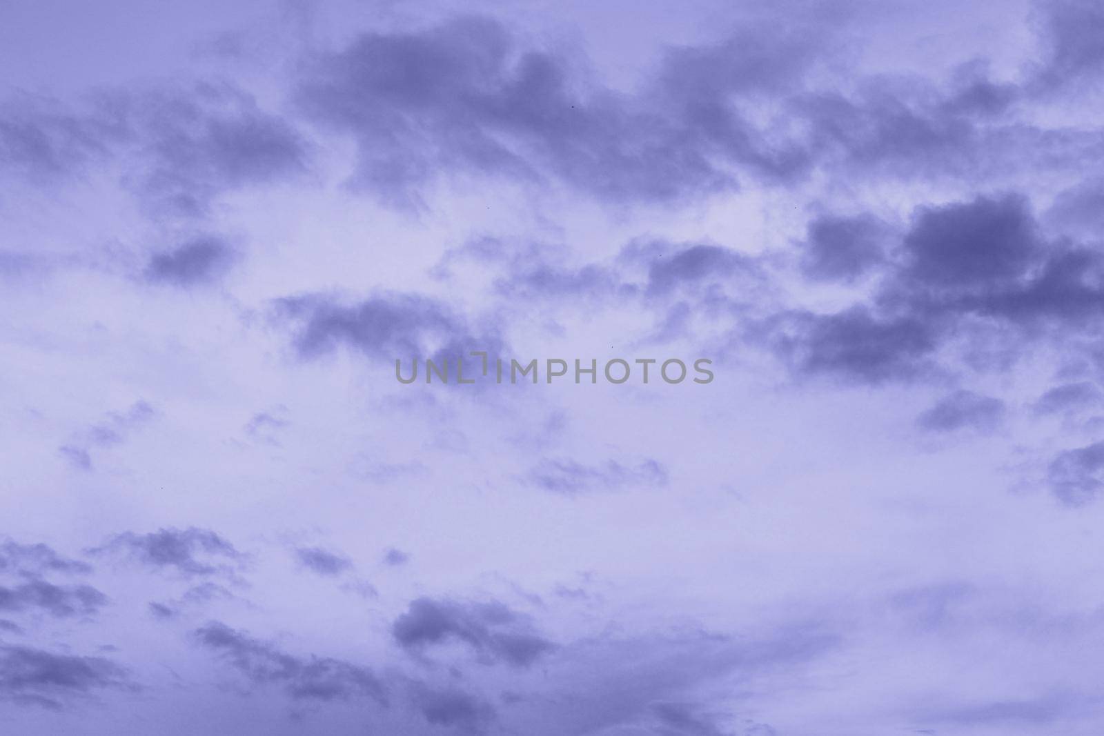 Very Peri sky and clouds. Monochrome background 2022 color of the year. High quality photo