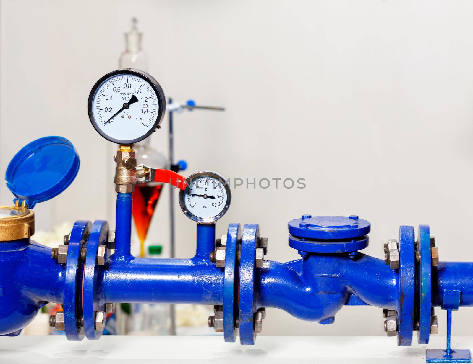 Installation of water measurement and pressure systems, close-up of pressure gauges, pipes and taps, control and accounting concept, copy space.