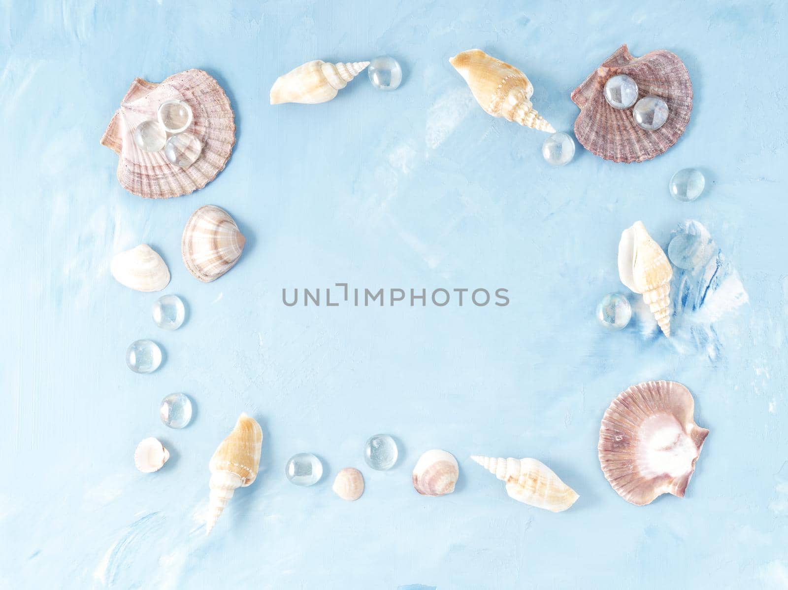 Mock up with frame of seashell on blue stone background, scallop shell, copy space. Summer concept by NataBene
