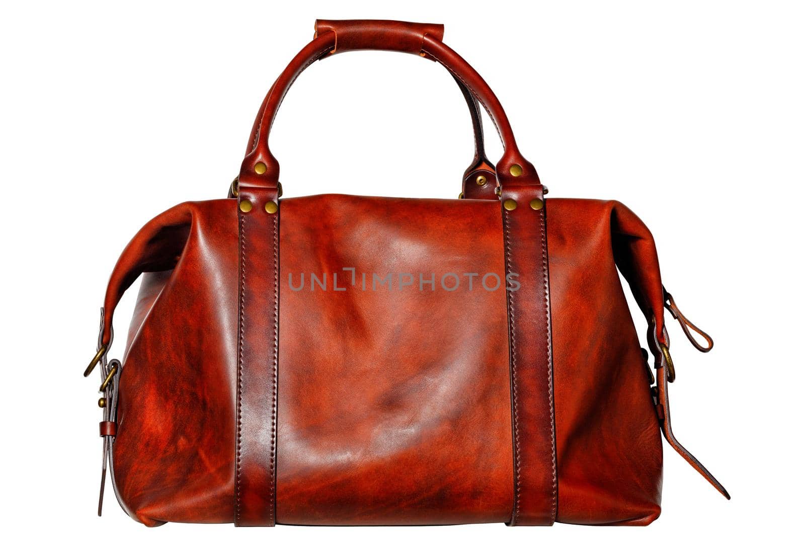 Beautiful red and brown leather bag with side fasteners, straps and brass buckles in vintage style on a white background.