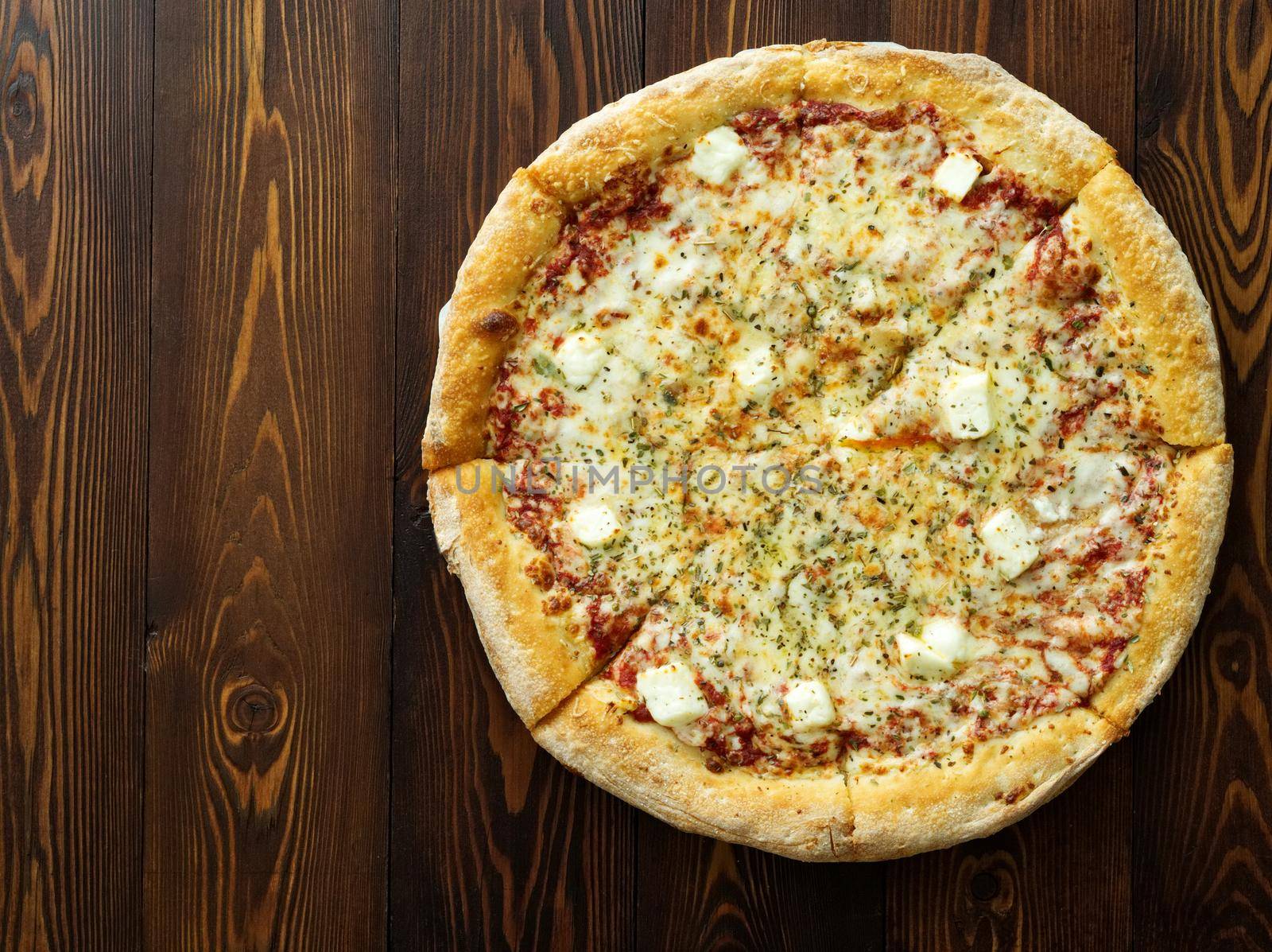 Four cheese pizza with Dor-blue, Parmesan, feta, oregano, mozzarella, tomato sauce, by NataBene