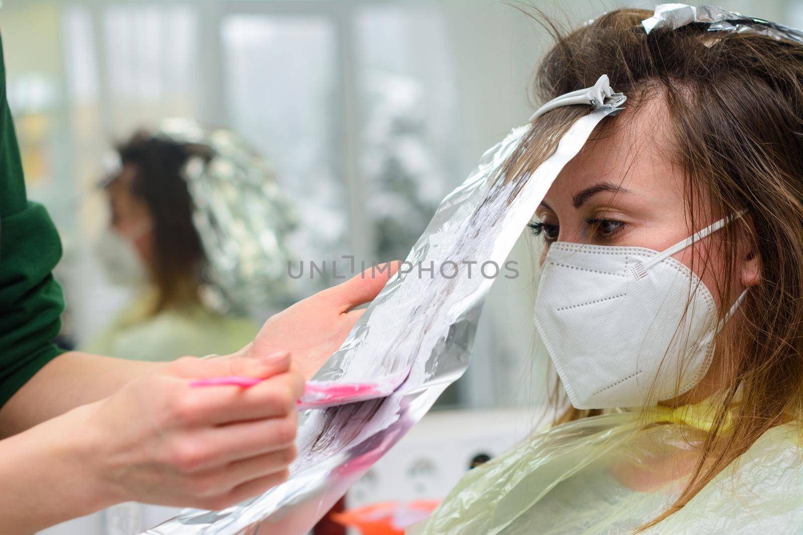 Hair coloring in the salon, hair bleaching. by Niko_Cingaryuk