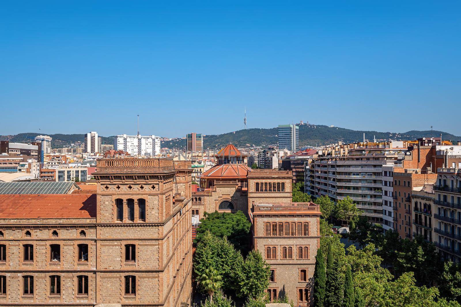 View of city with old historical and modern buildings in the center of Barcelona on sunny day. Spain.