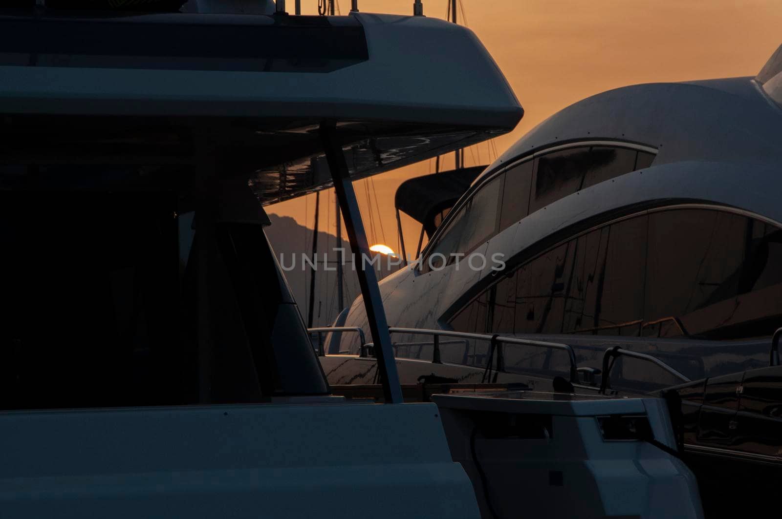 Panoramic view of marina di Olbia port and yacht marina at sunset by massimocampanari