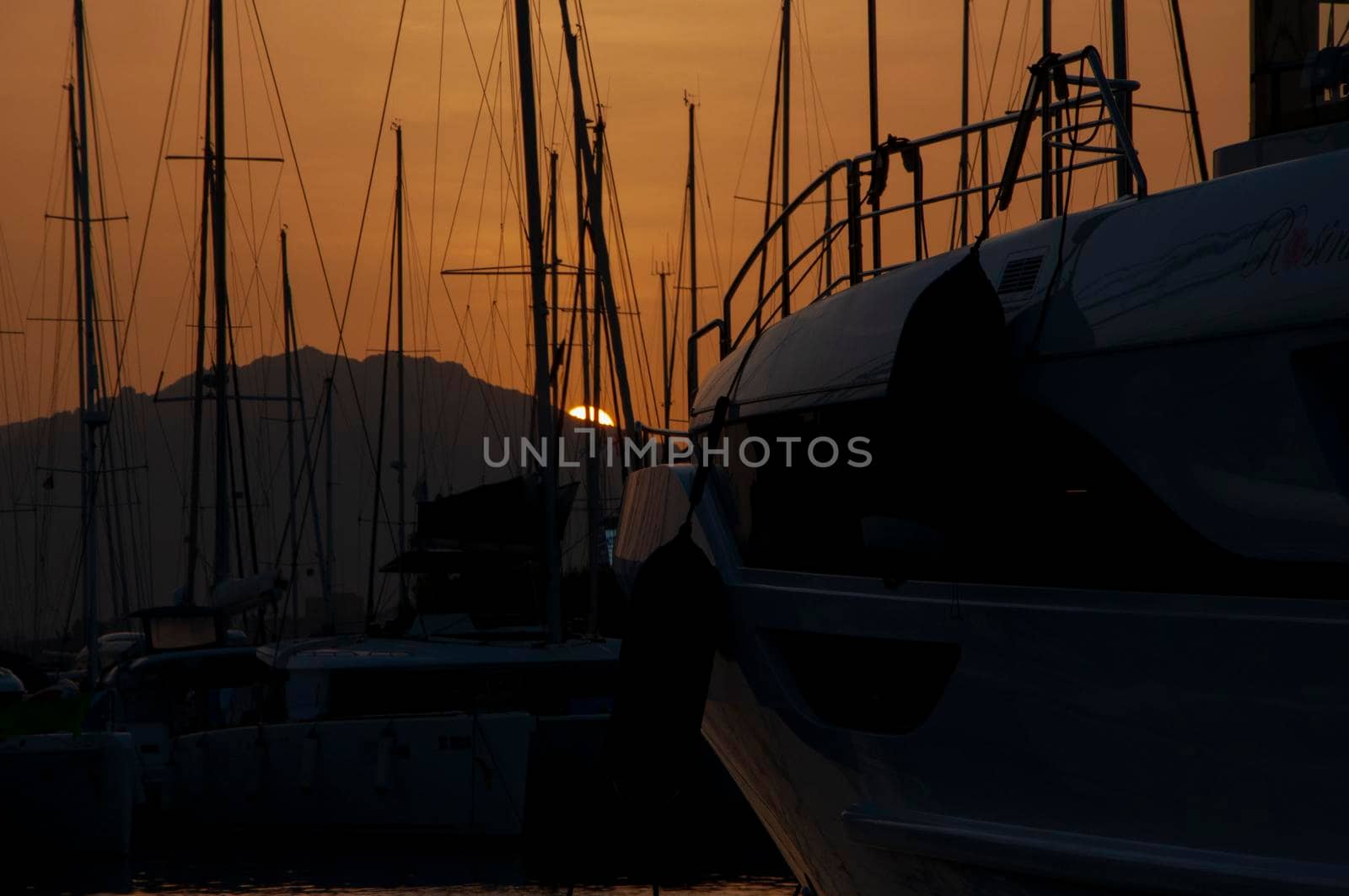 Olbia, Sardinia / Italy - 2019/8/21: Panoramic view of marina di Olbia port and yacht marina at sunset