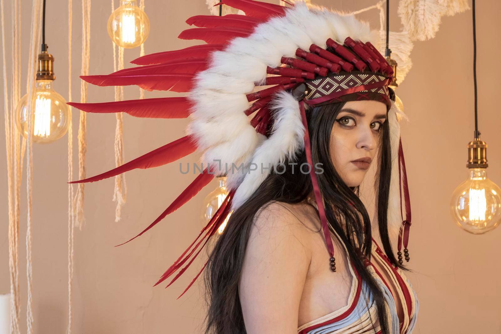 Native American Indian woman. Fashionable young lady in Indian roach. Boho style dress.