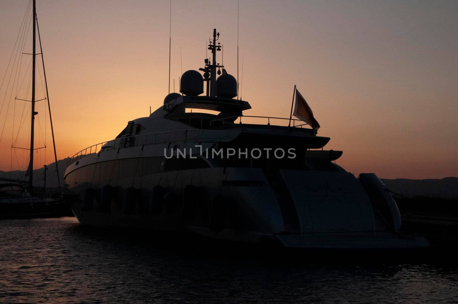 Panoramic view of marina di Olbia port and yacht marina at sunset by massimocampanari