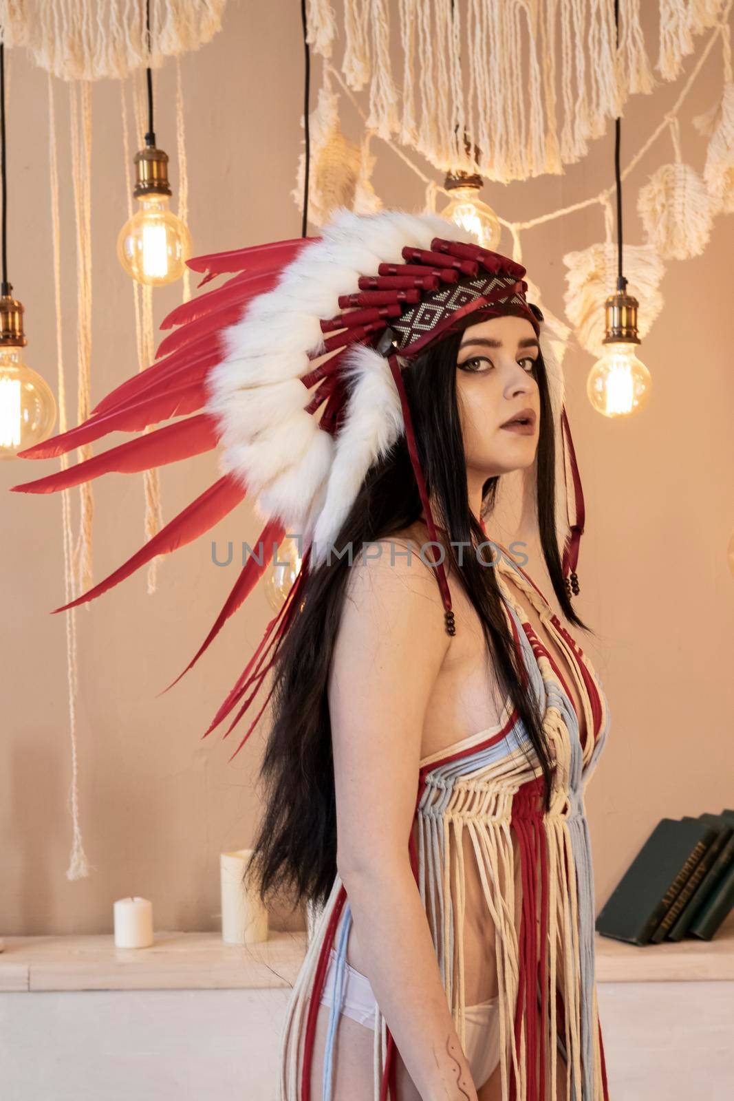 Native American Indian woman. Fashionable young lady in Indian roach. Boho style dress by Hitachin