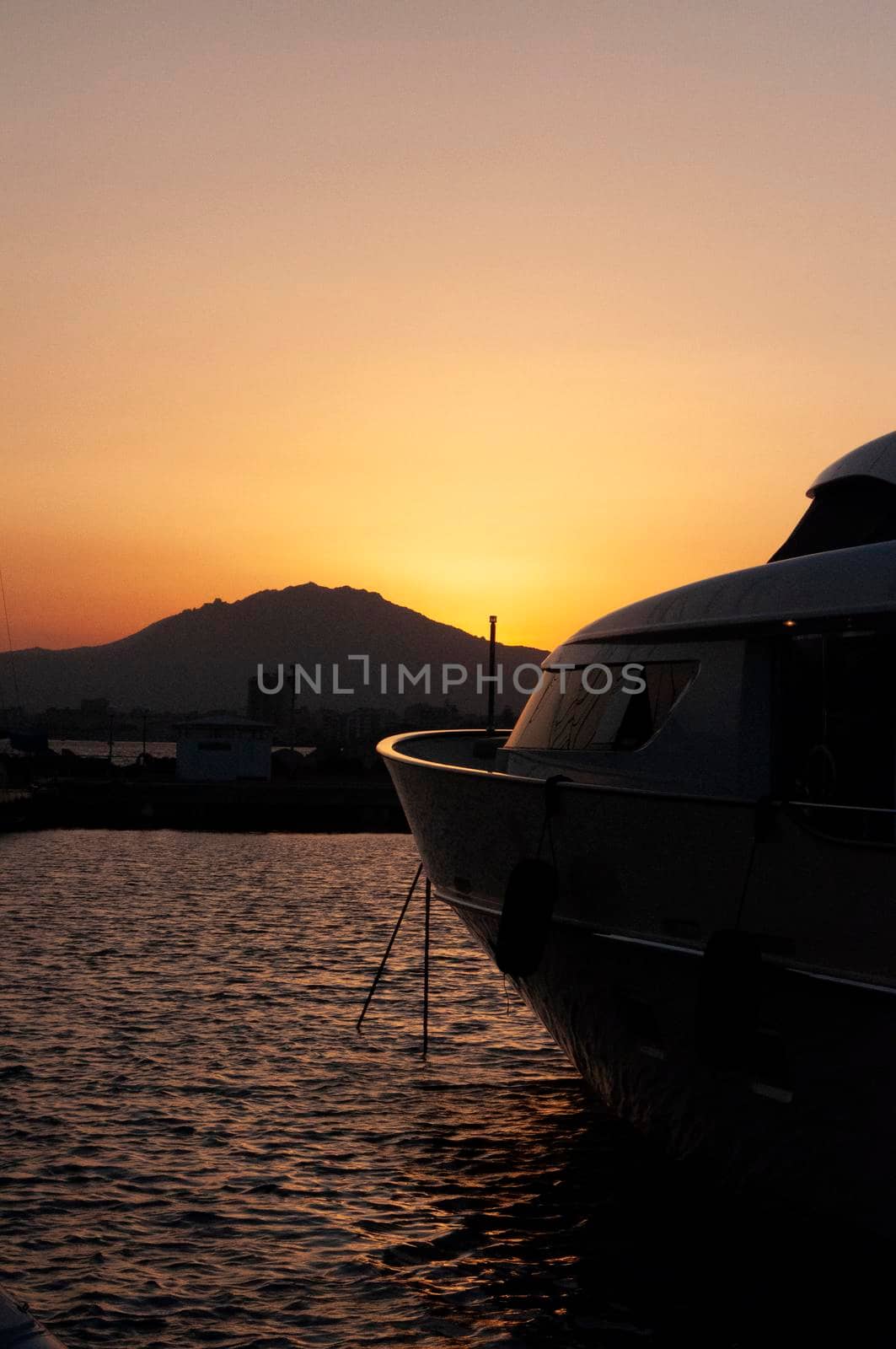 Olbia, Sardinia / Italy - 2019/8/21: Panoramic view of marina di Olbia port and yacht marina at sunset