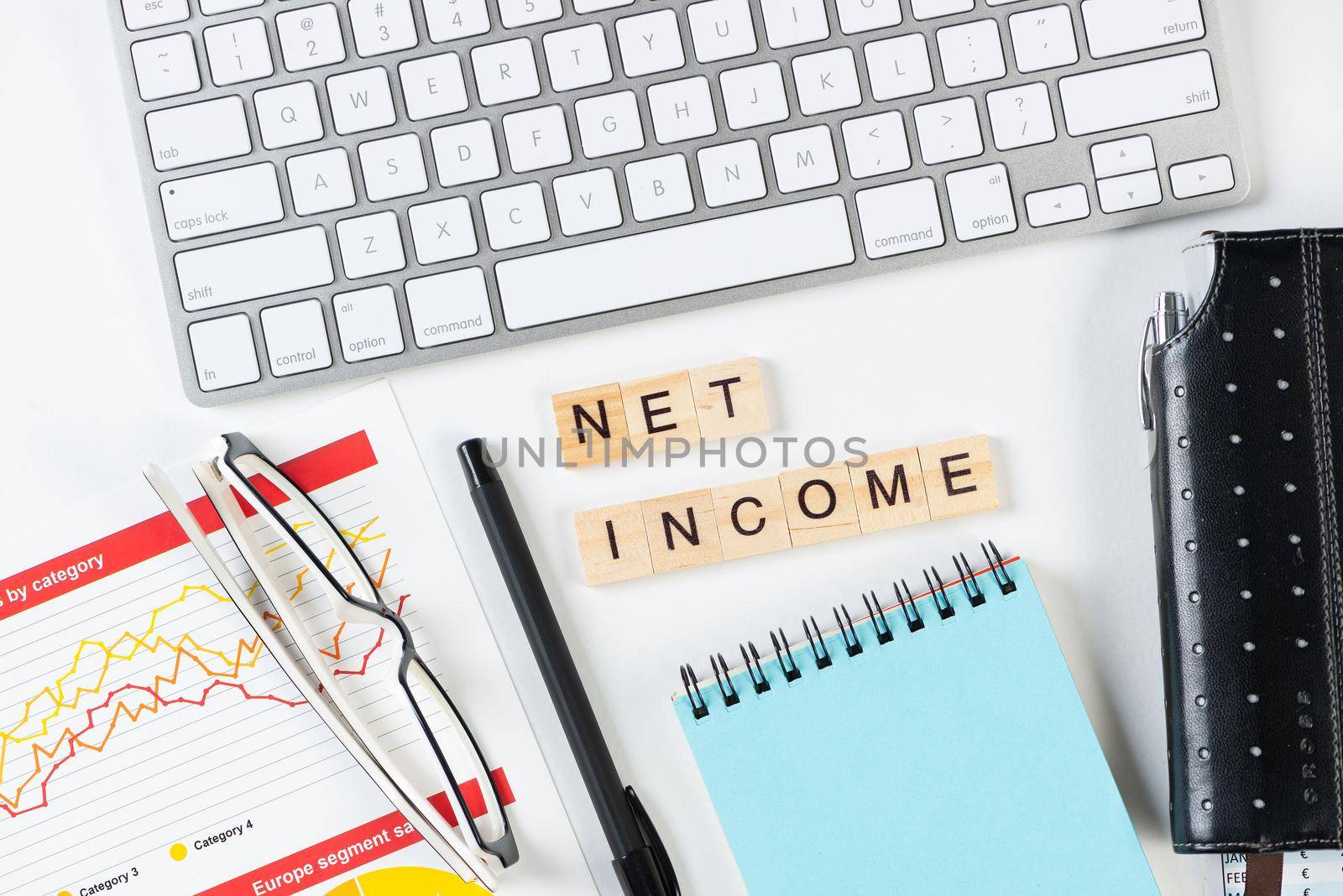 Net income concept with letters on cubes by adam121