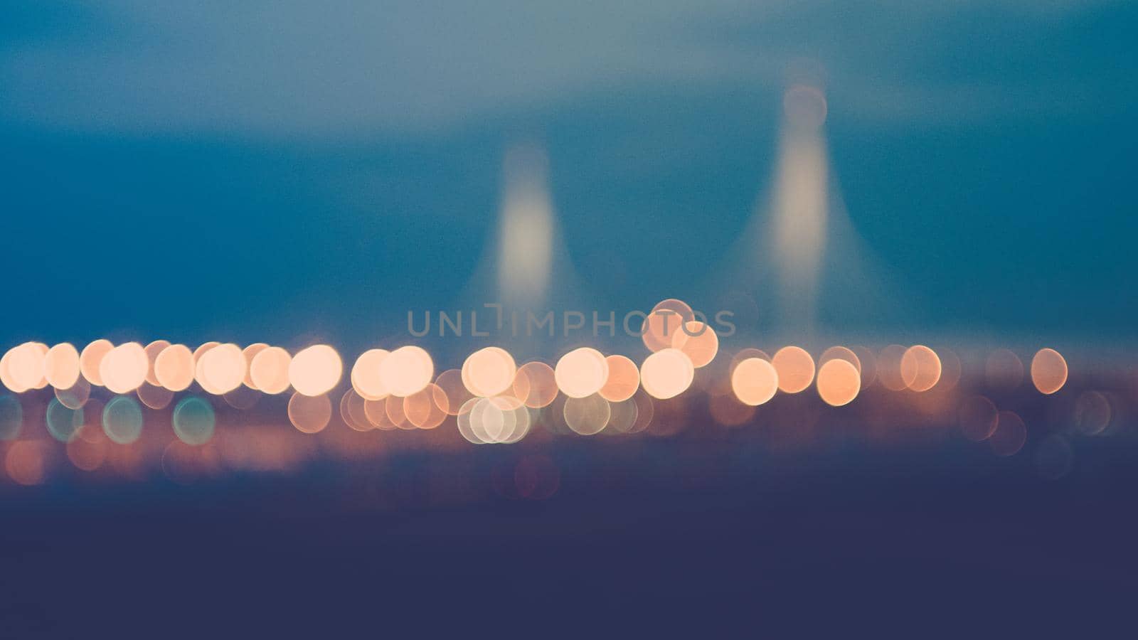lights of the night city bokeh from light of headlights of cars, bridges, sky, road, lights.