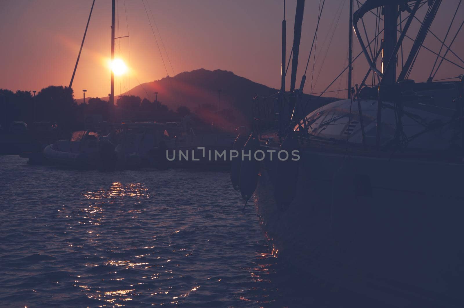 Panoramic view of marina di Olbia port and yacht marina at sunset