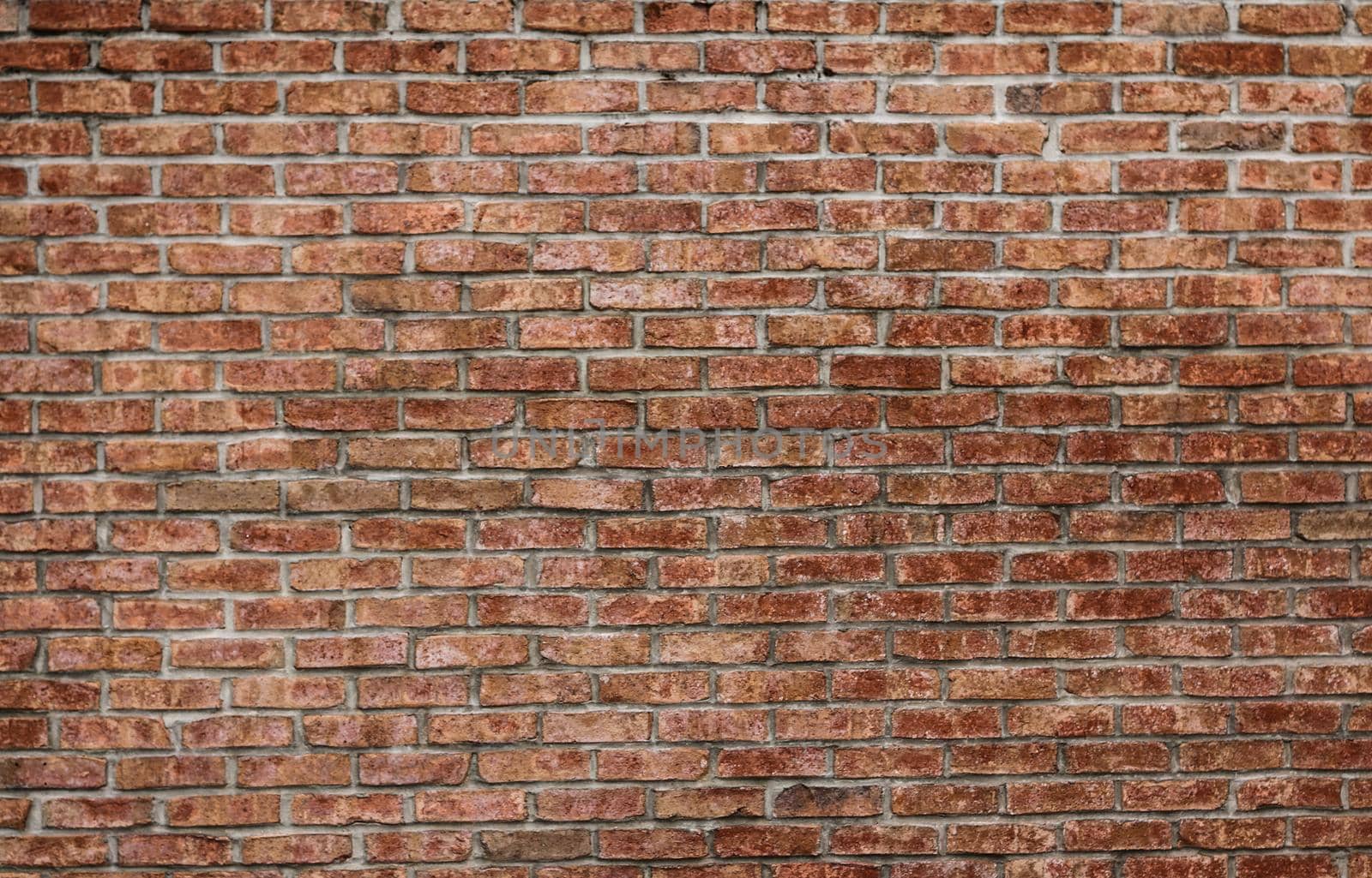 A red brick wall aged by time.Texture or background