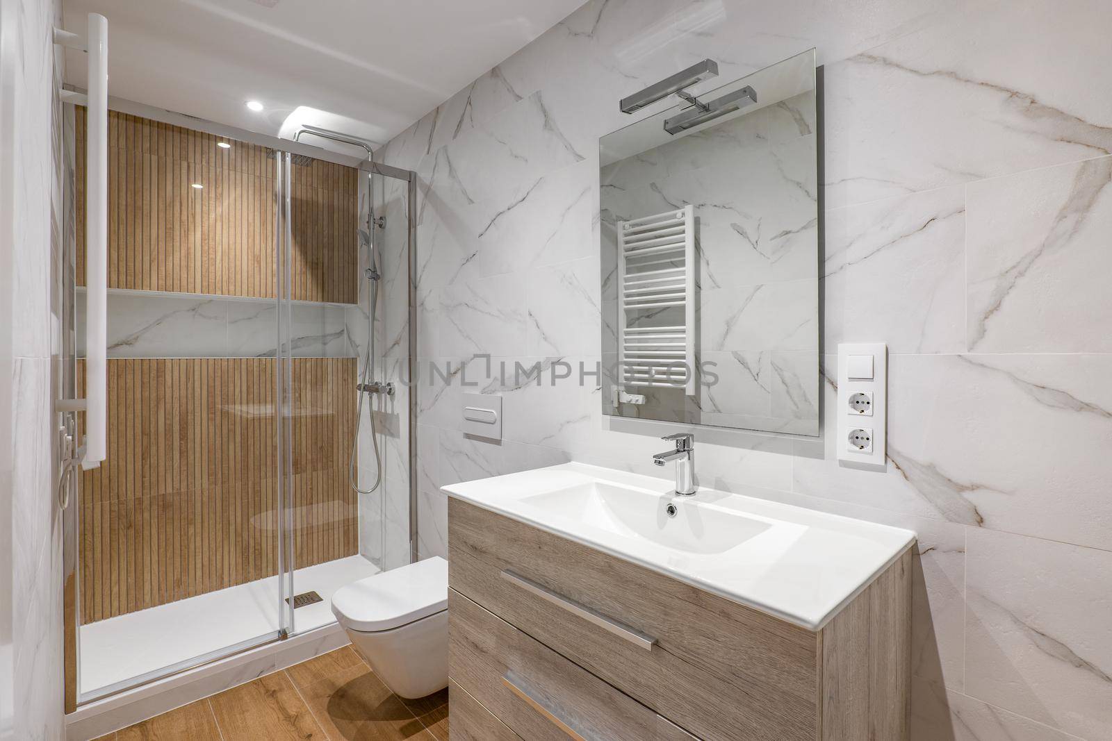 Interior of modern refurbished bathroom with shower with wooden finishing.