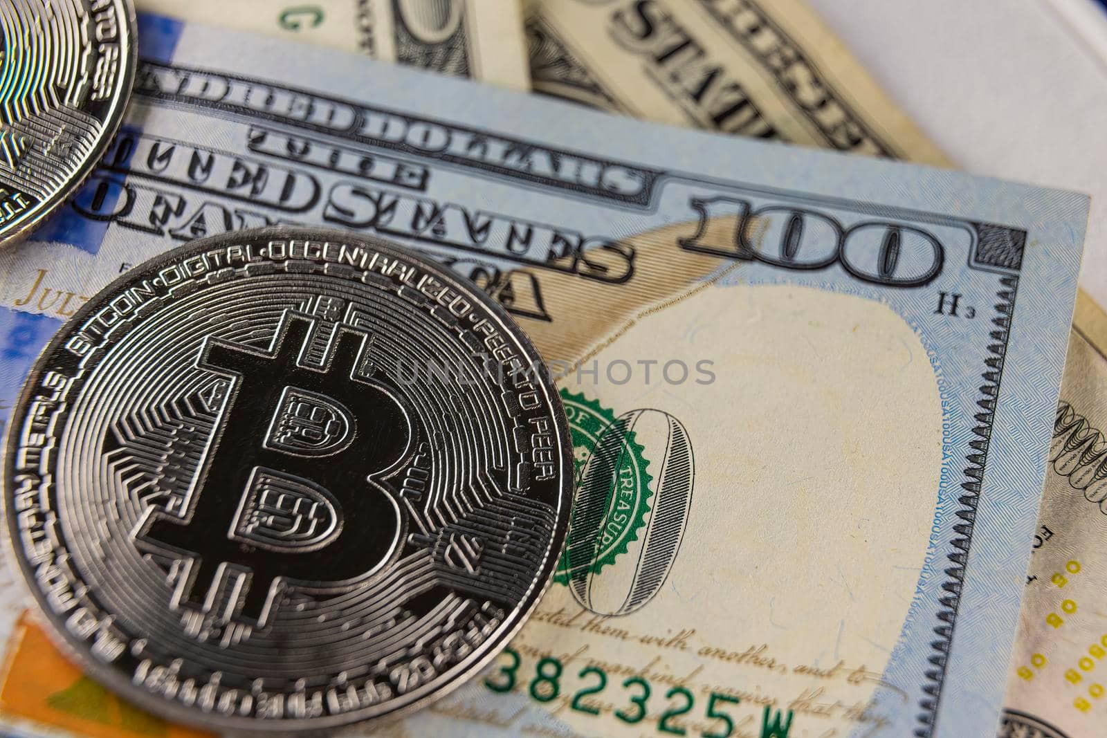 bitcoin coin flying on hundred dollar bill by zokov