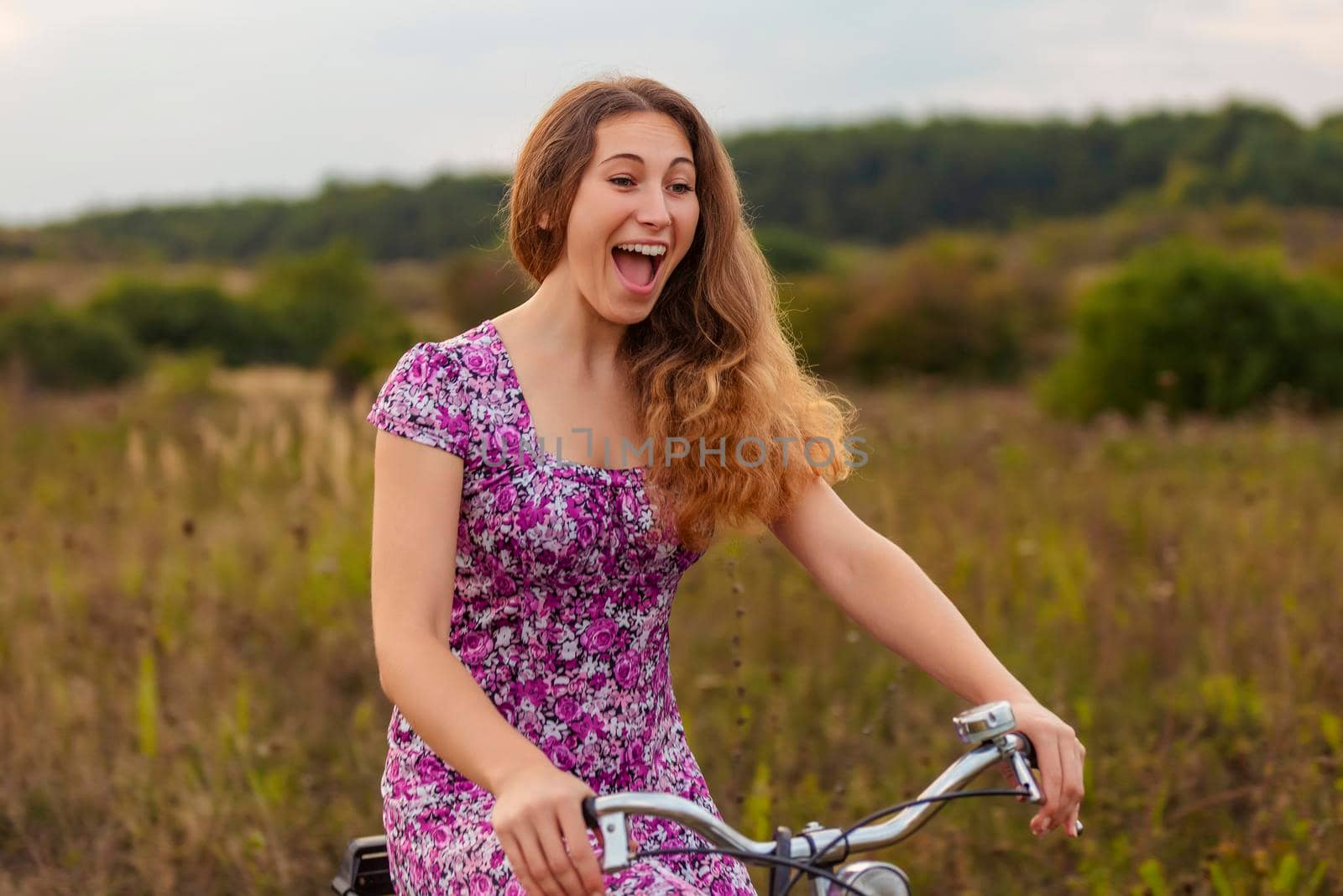 woman with bicycle in nature by zokov