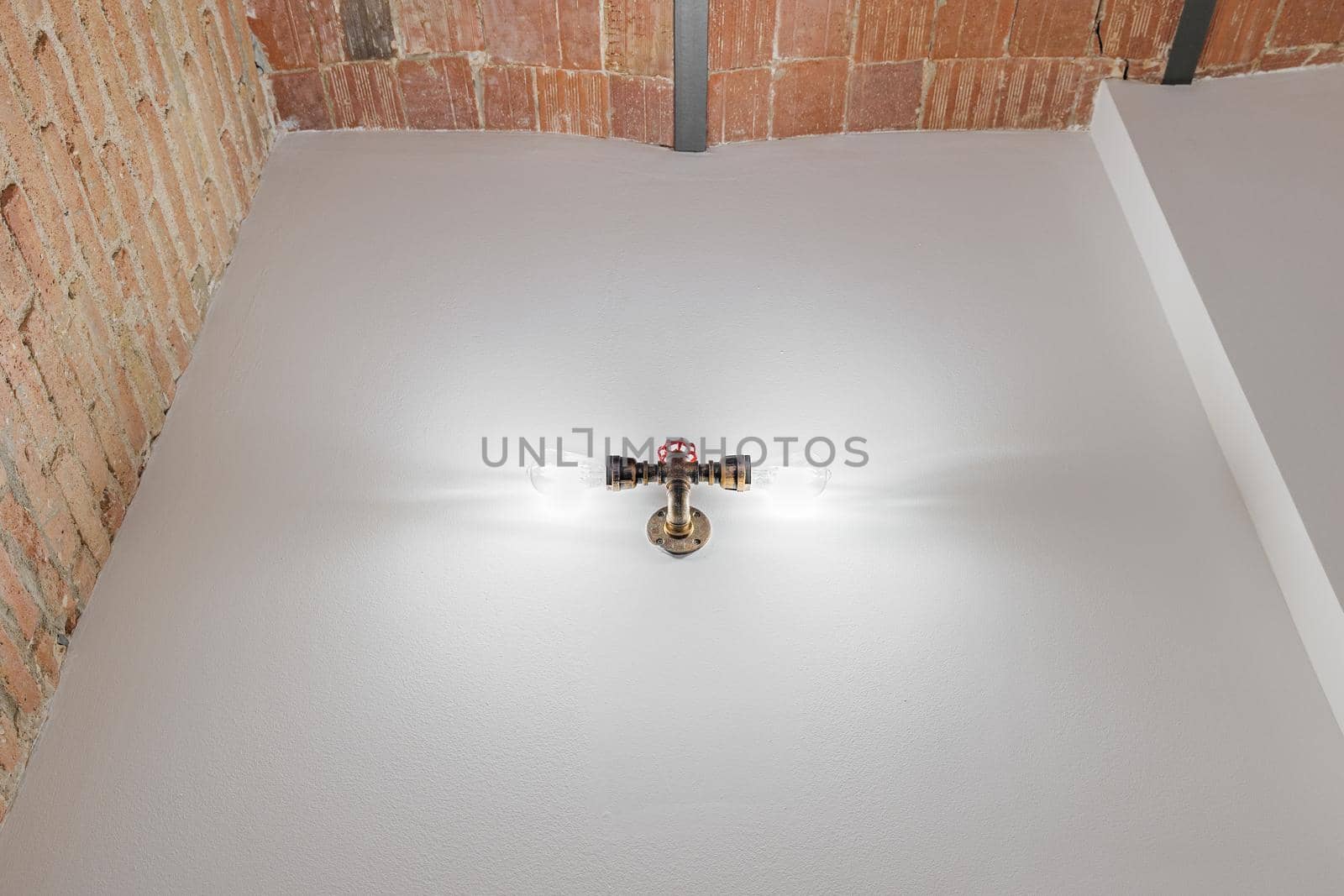 Empty room background with white and brick wall and double vintage spotlight.