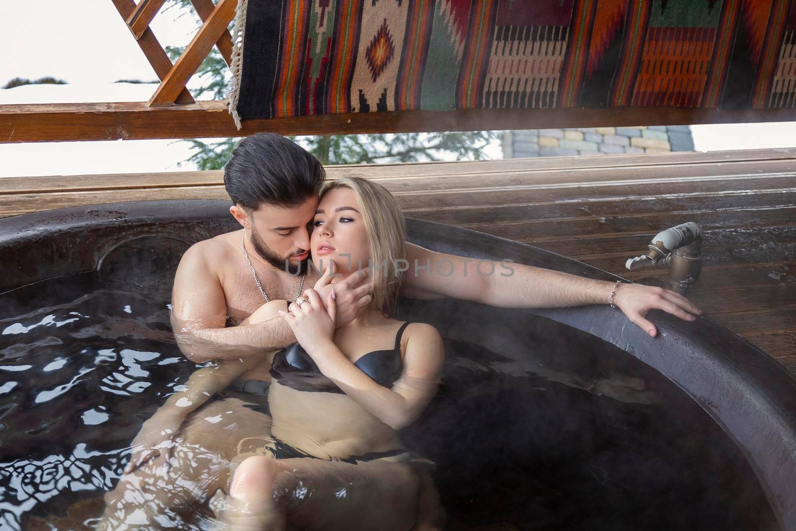 beautiful couple bathing in a vat