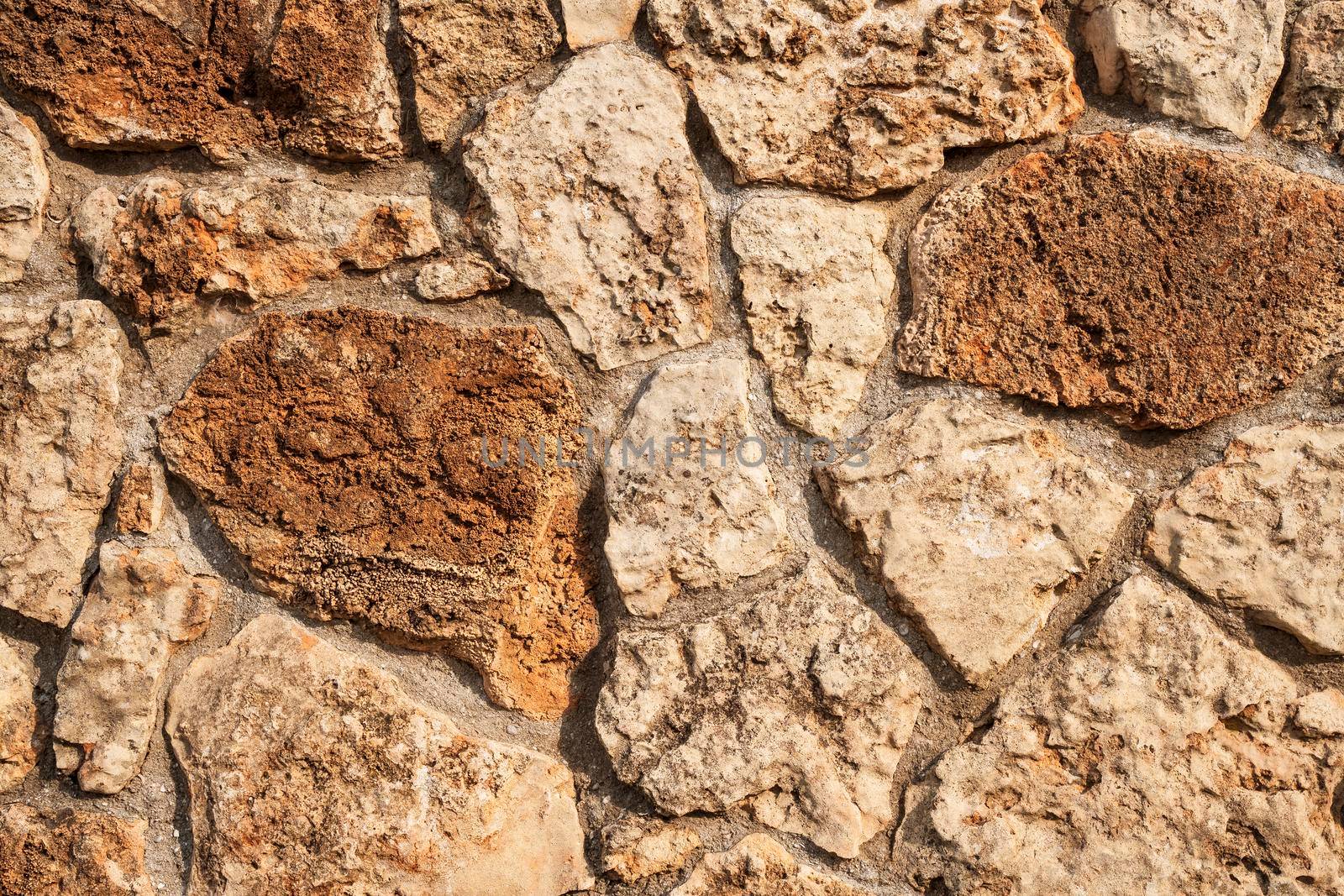 Modern seamless wall made of natural red and white stone, background and texture of old brick walls. by Matiunina