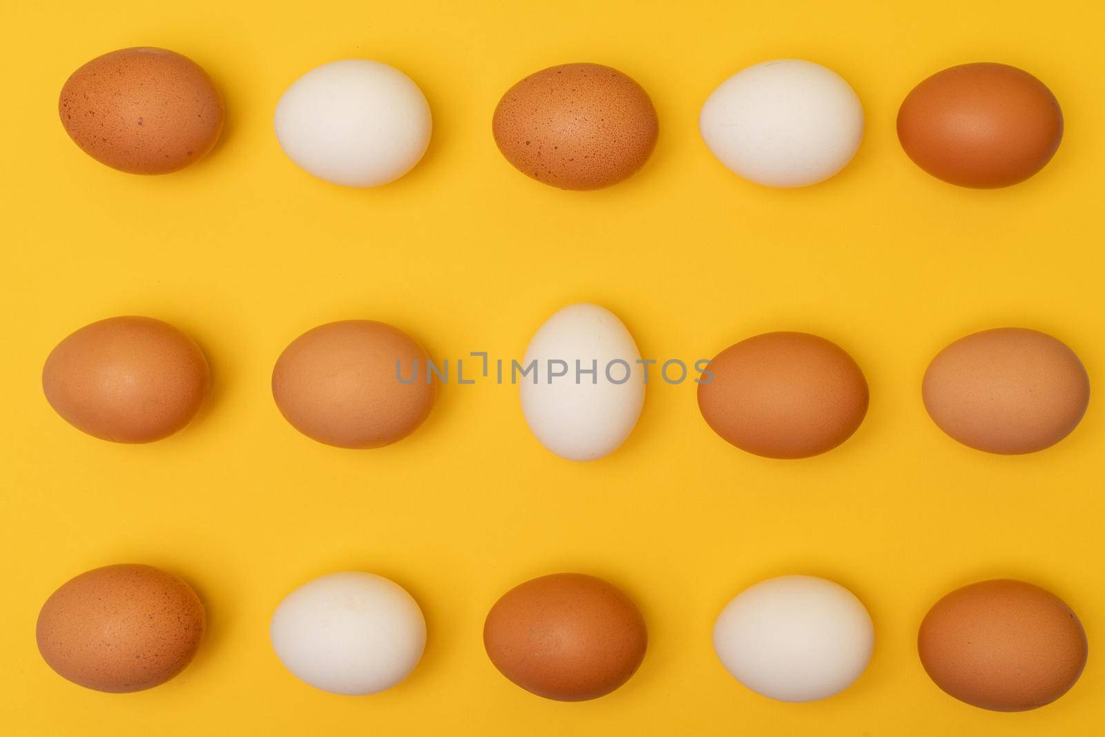 Easter eggs on a yellow background, place for an inscription in the center by Matiunina