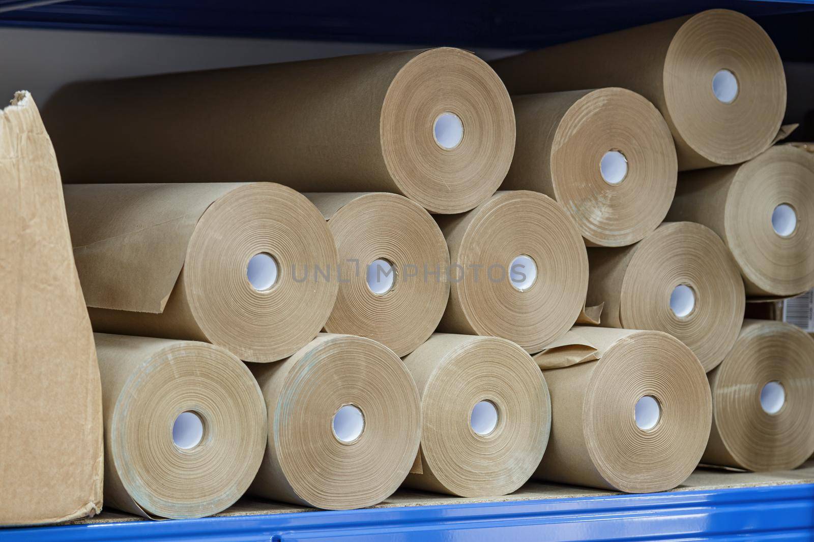 Craft paper rolls folded on a shelf in a warehouse by apavlin
