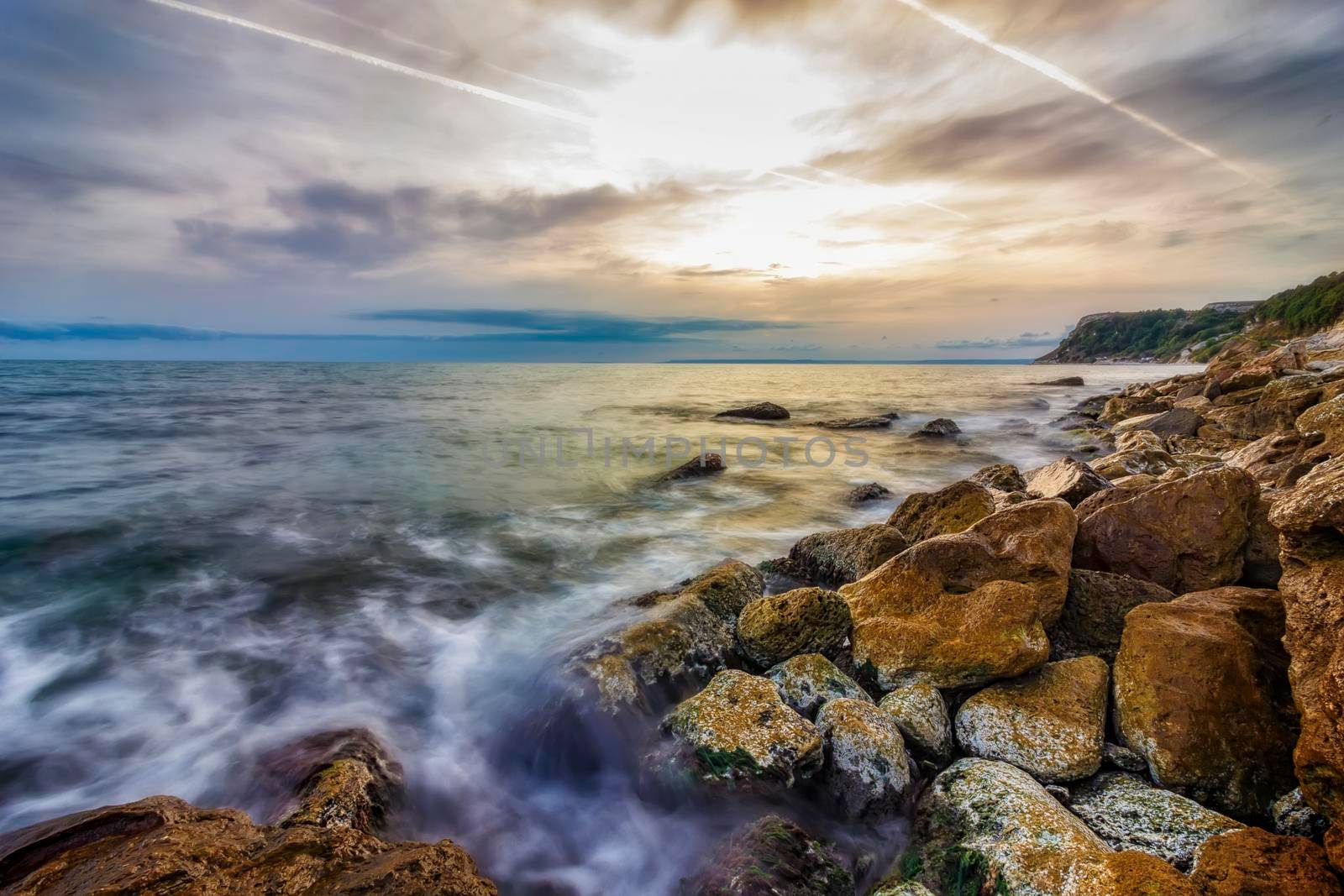 Beauty sea rocky coast with color moss on the stones. Black sea