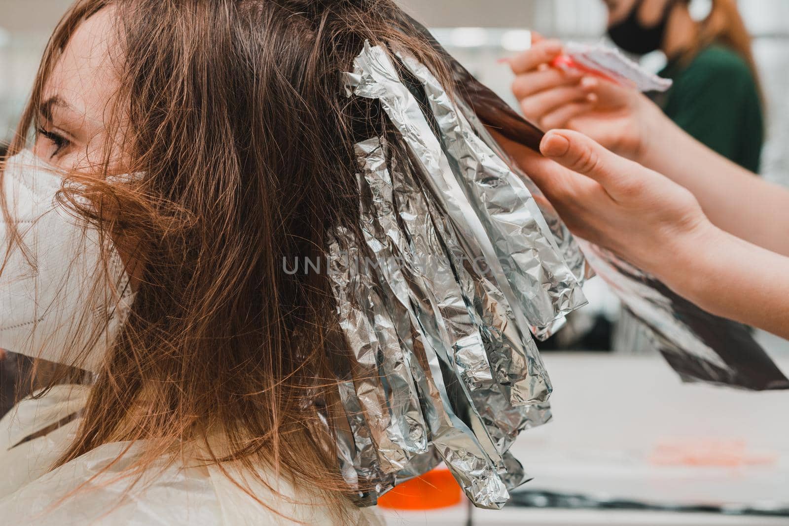 The work of hairdressers during the world quarantine, the process of applying hair dye. new