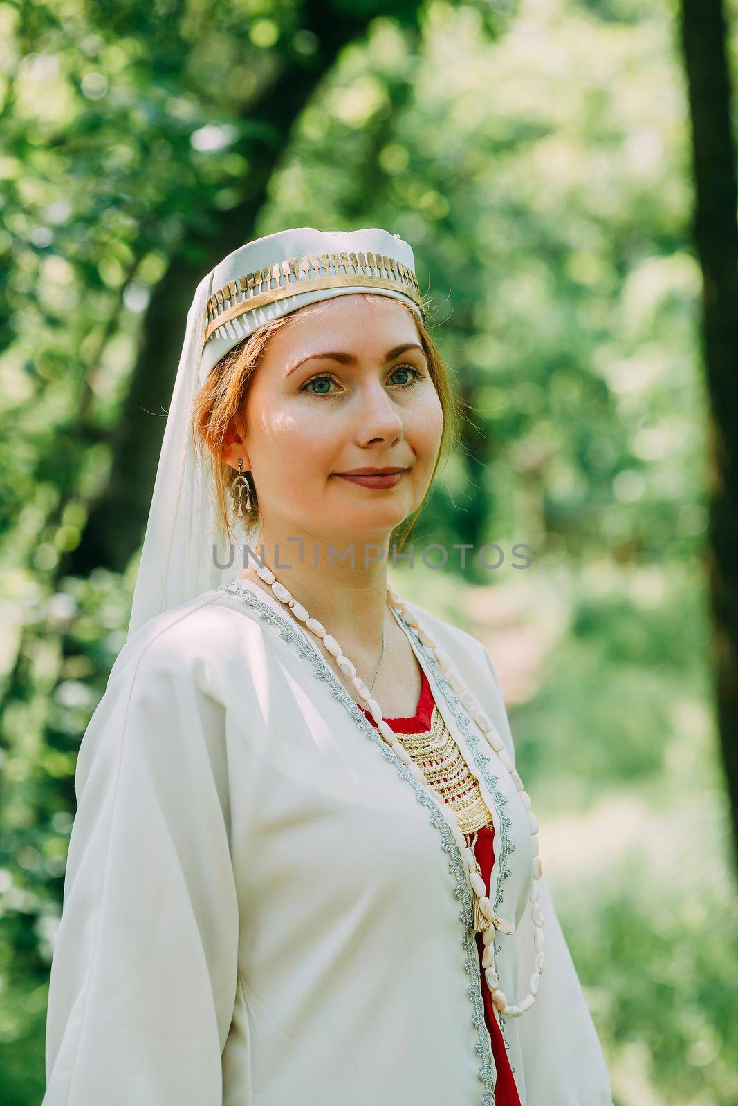 happy woman pagan priestess prepared for the ceremony. old faith in our time. seasons, summer. by mosfet_ua