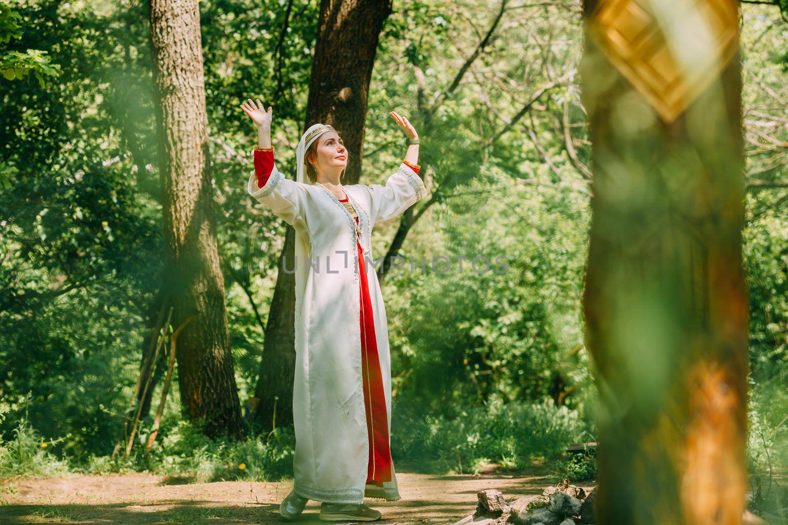 happy woman pagan priestess prepared for the ceremony. old faith in our time. seasons, summer