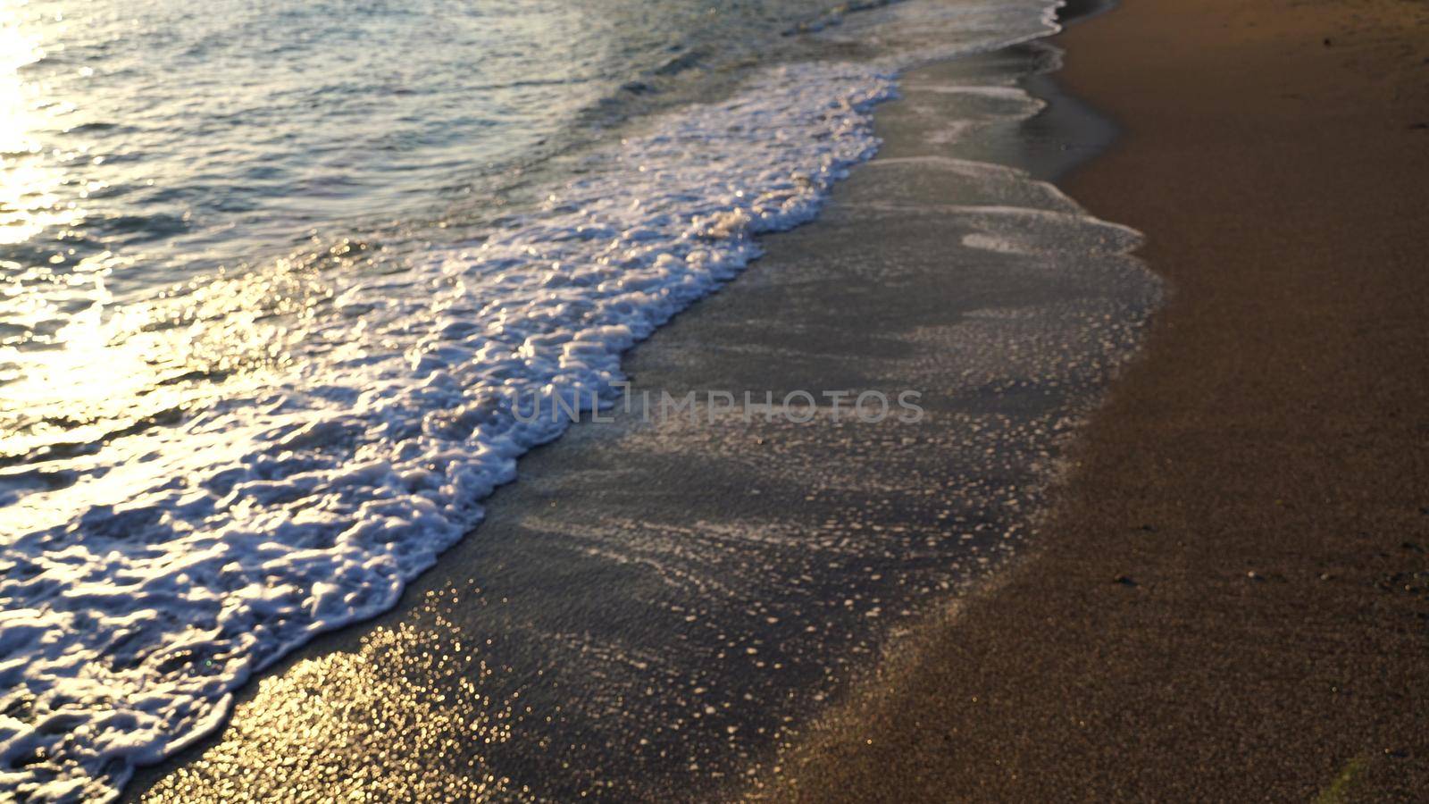 Beautiful sea sunset. The flaming sky and the glittering Golden waves