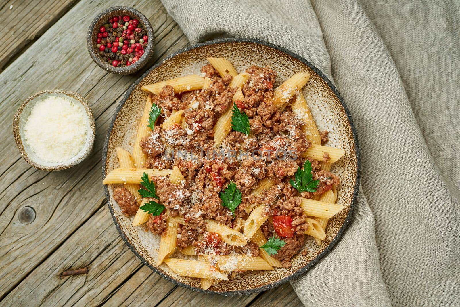 Bolognese pasta. Fusilli with tomato sauce, ground minced beef. Traditional italian cuisine. Top view.