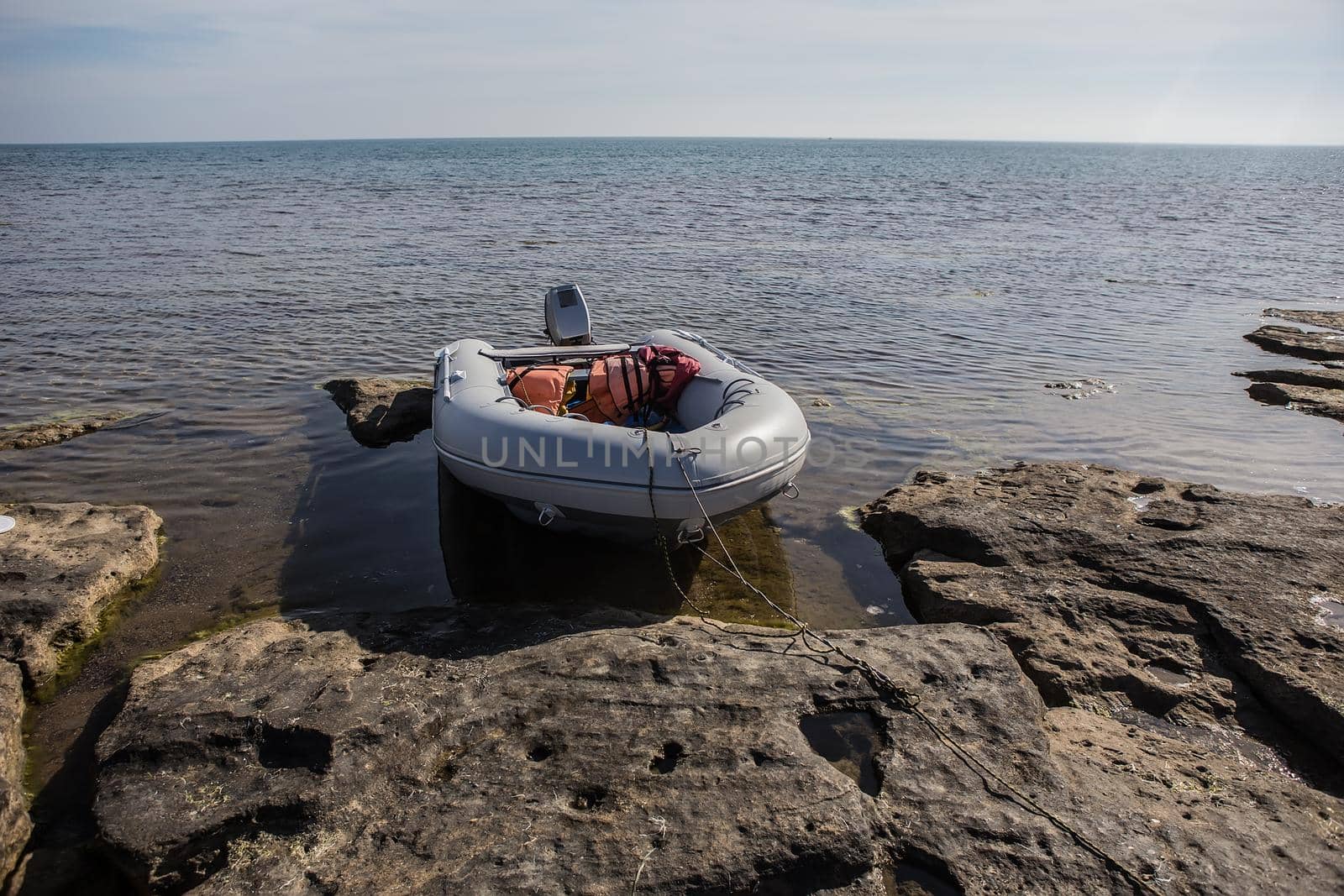 Rubber inflatable motor boat near the sea shore