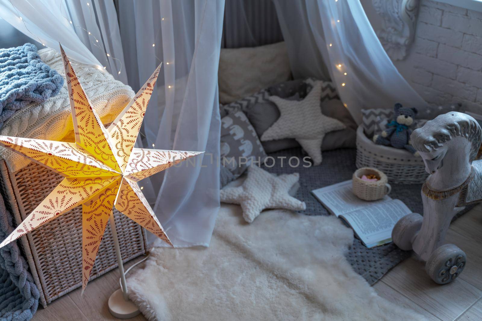 Childen's room corner with a beautifully decorated play tipi tent. Wigwam by Matiunina