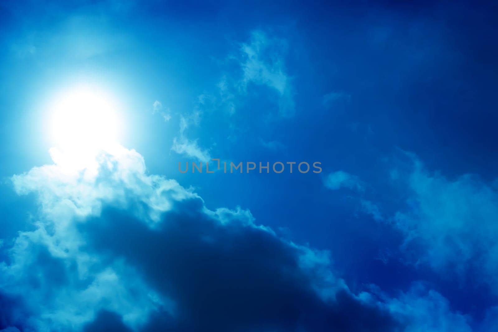 Beautiful dark sky with sun and clouds