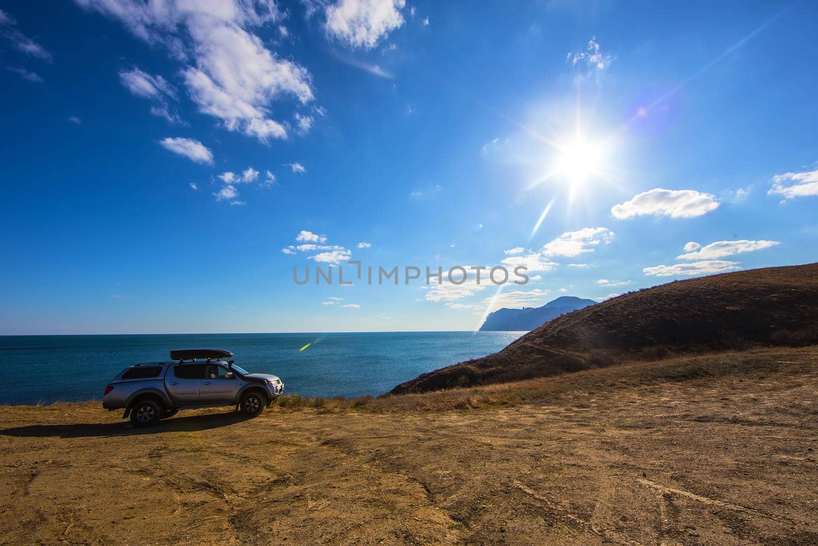 off-road vehicle on the high coast of the sea