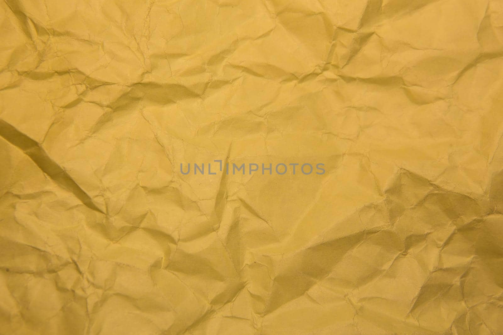 Crumpled yellow paper. Background, close-up