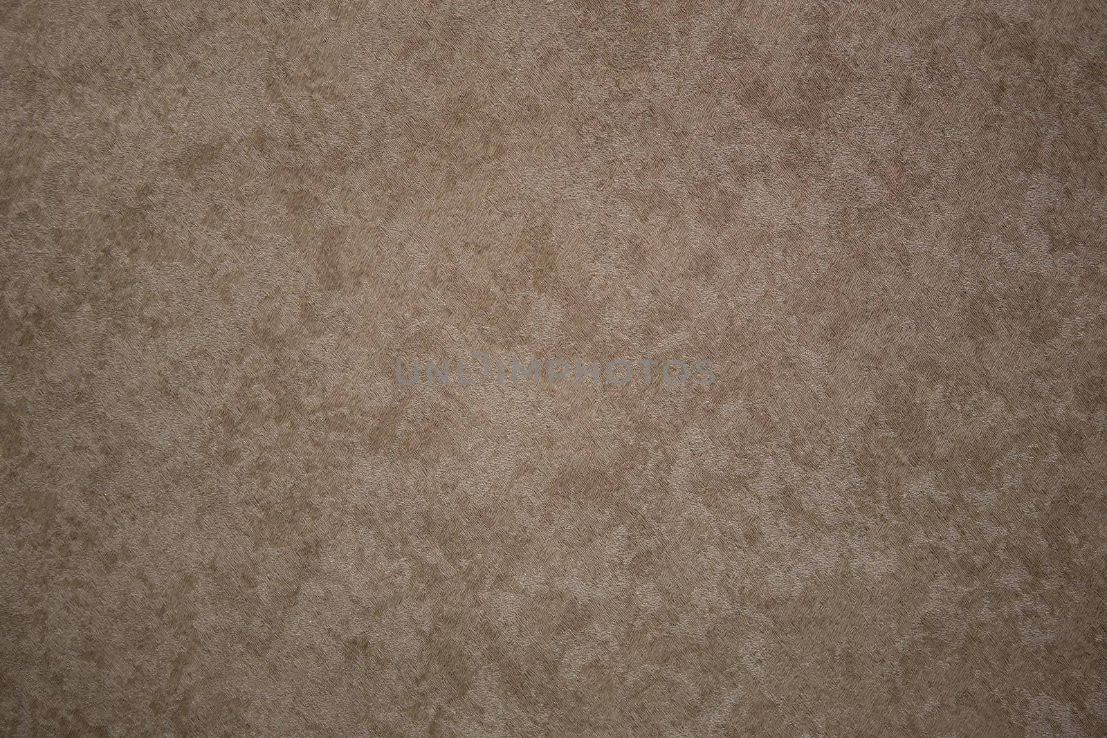 Spotted abstract textural brown background