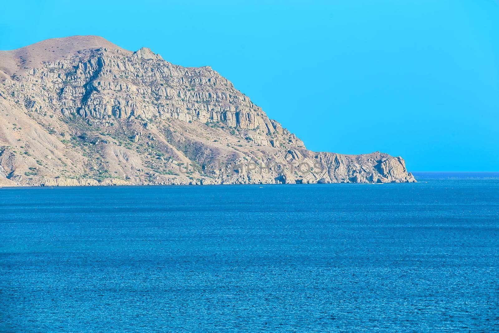Landscape.Sea bay surrounded with mountain range.
