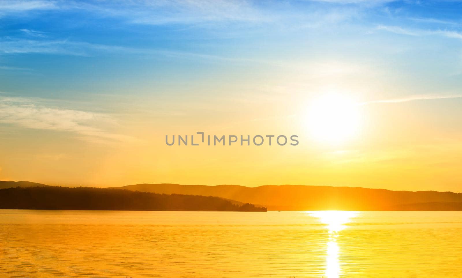 View of the sea bay and mountains at sunset.