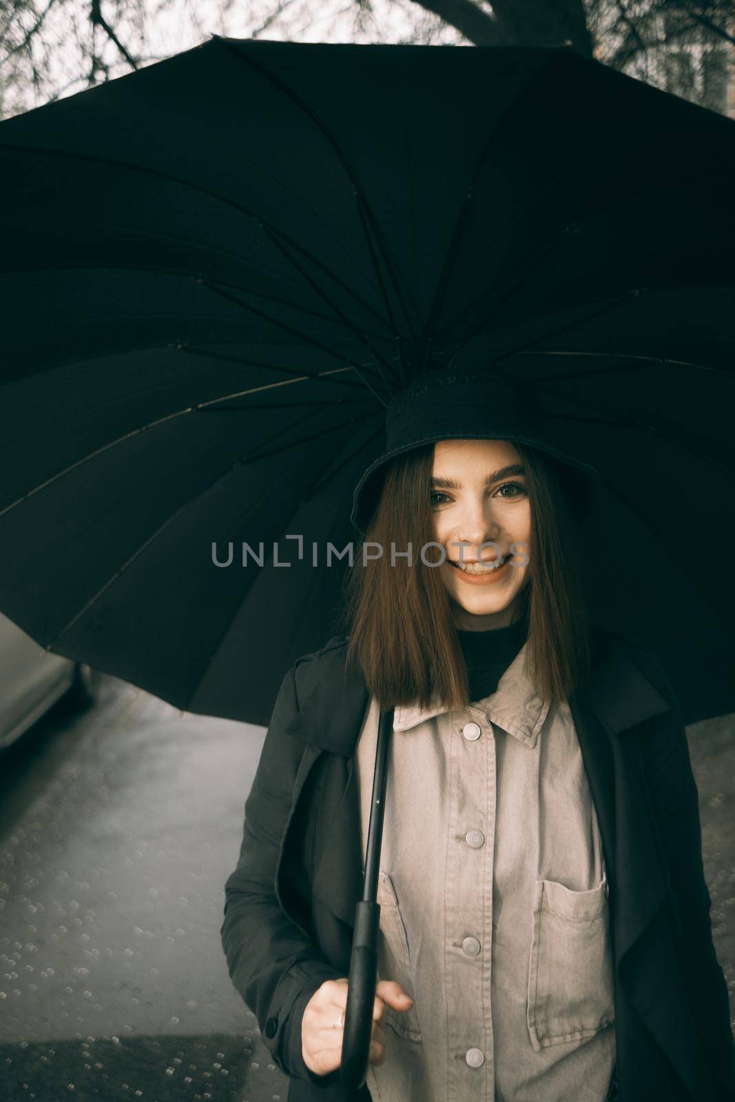 Emotional portrait, girl with umbrella, emotion - reaction to surprise, fright by Symonenko