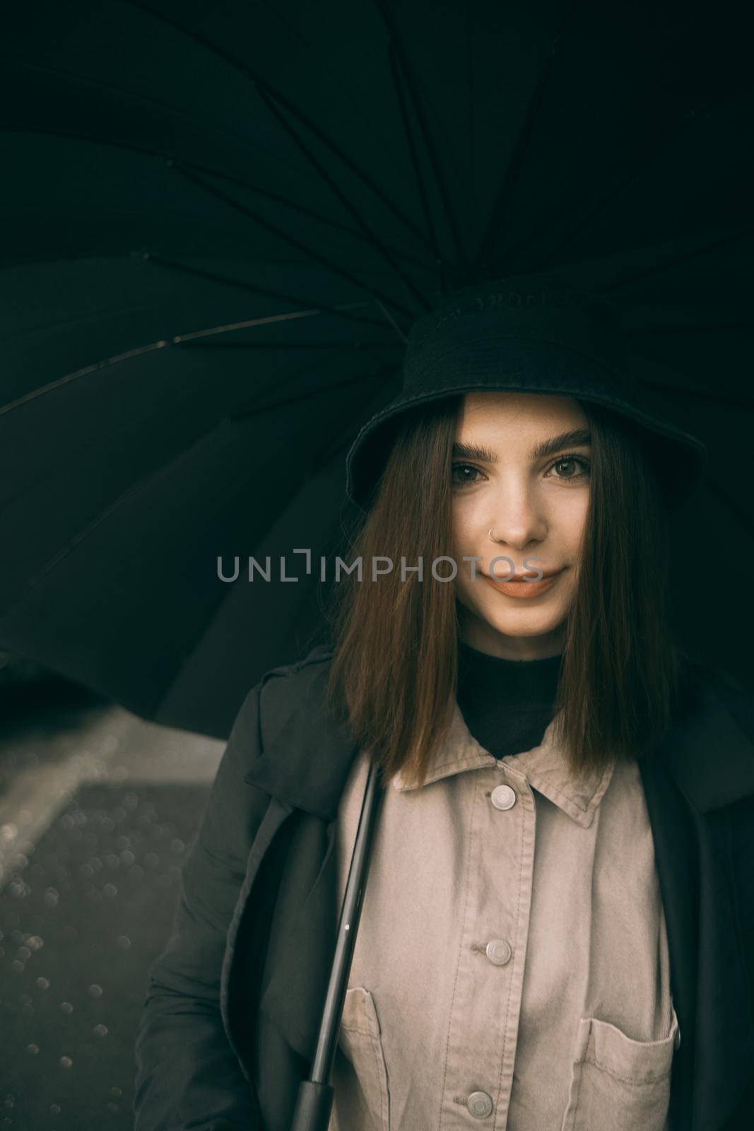Emotional portrait, girl with umbrella, emotion - reaction to surprise, fright by Symonenko