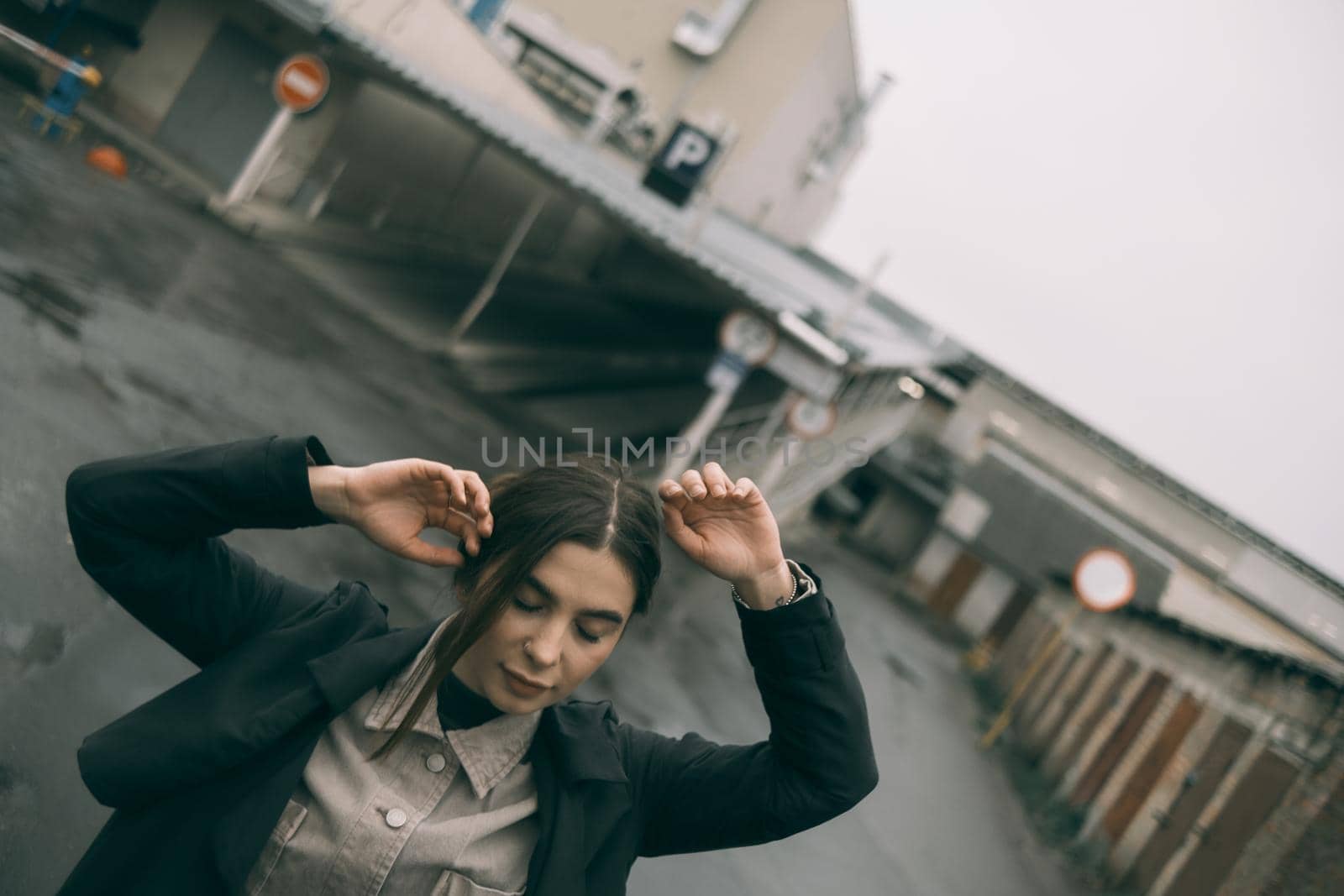 sensual portrait of brunette woman on street