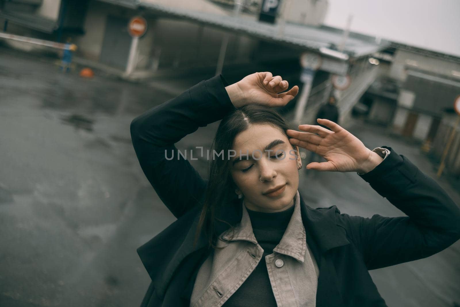 sensual portrait of brunette woman on street