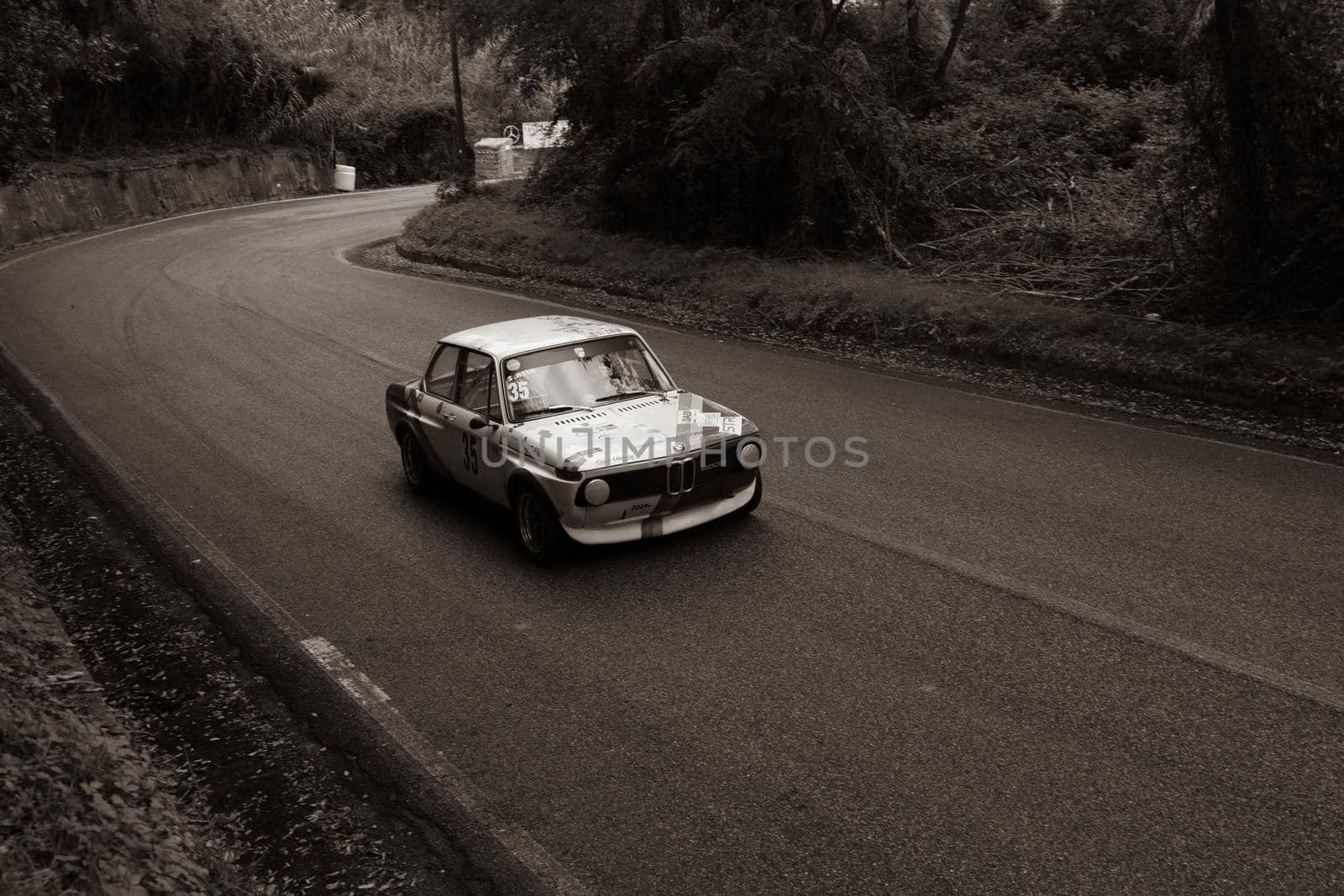 PESARO COLLE SAN BARTOLO , ITALY - OTT 10 - 2021 : BMW 2002 on an old racing car ifor rally