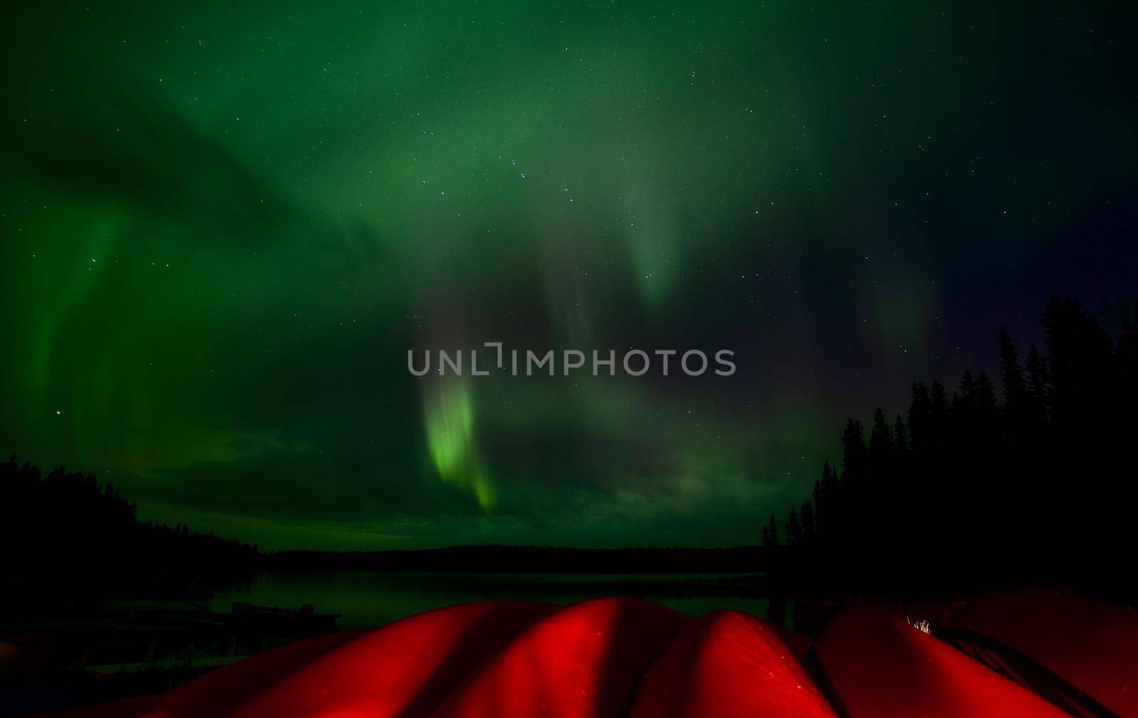 Aurora explosion in Saskatchewan Canada very colorful canoes