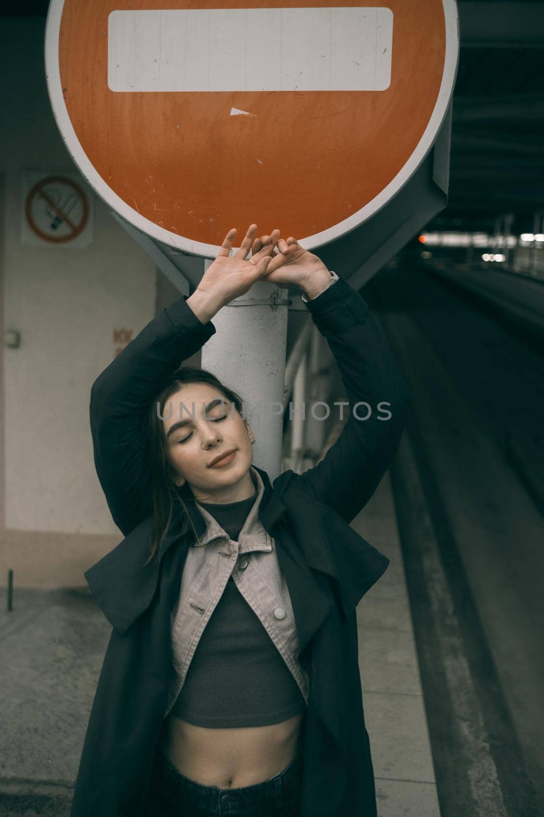 woman portrait near stop sign