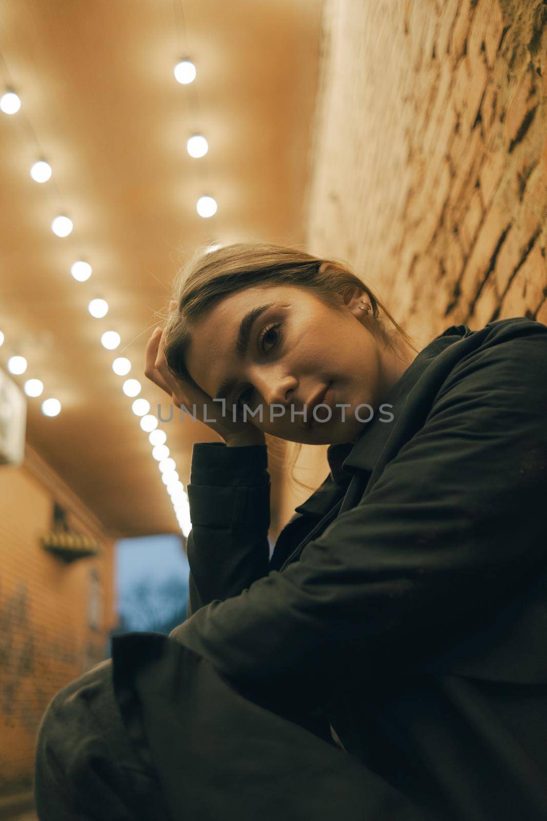 portrait of a woman in a lantern-lit alley late in the evening