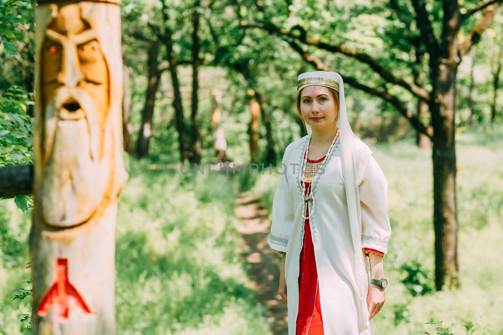 happy woman pagan priestess prepared for the ceremony. old faith in our time. seasons, summer. by mosfet_ua