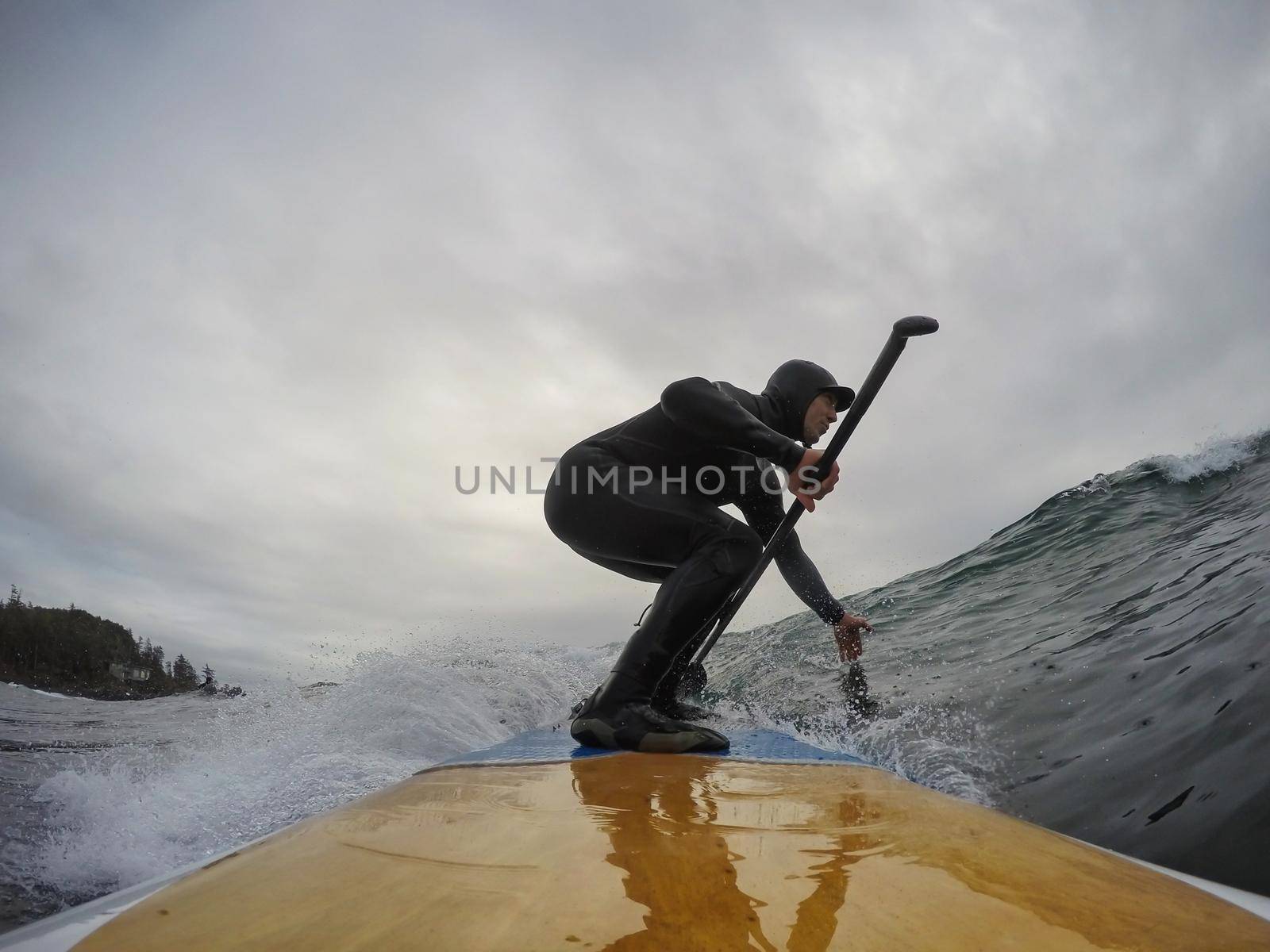 Surfer riding a wave in the ocean.