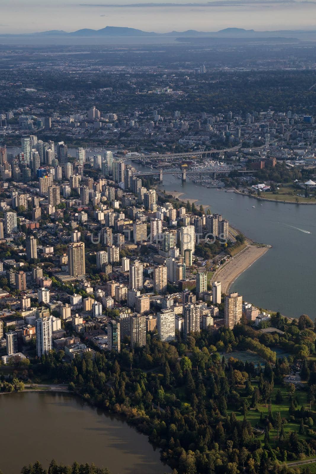Downtown Vancouver City , Stanley Park and False Creek viewed from an aerial perspective. Picture taken in British Columbia, Canada, during a sunny day.